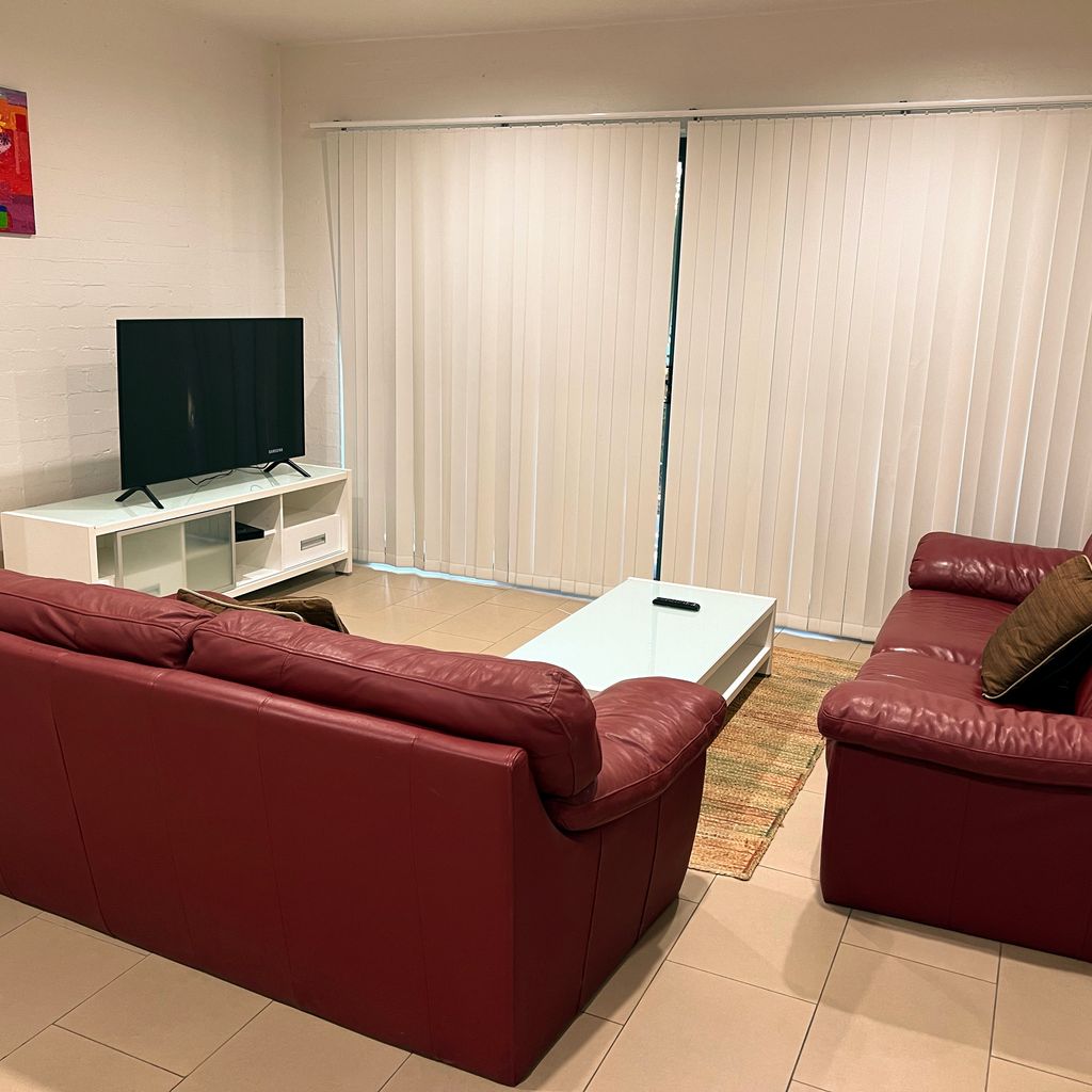 Downstairs living area (blinds closed).