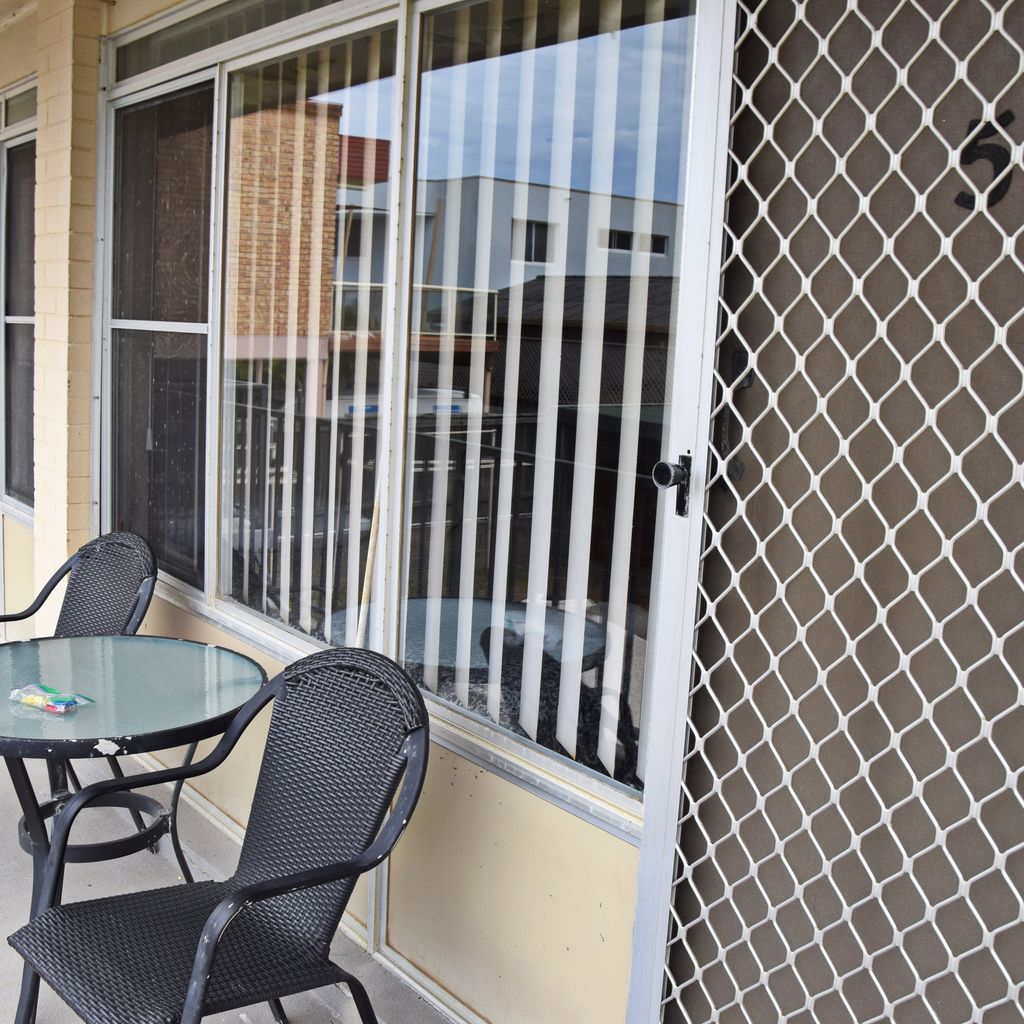 table and chairs outside of unit 5.