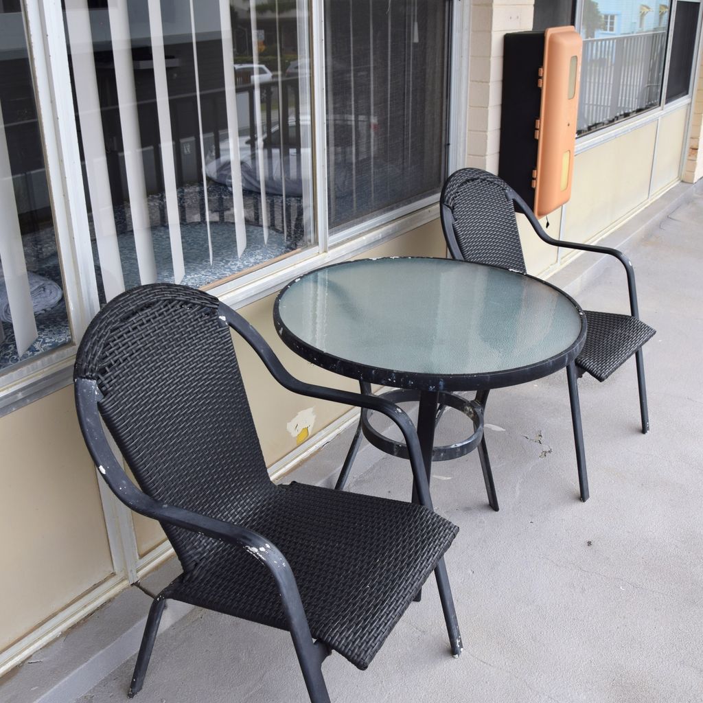 Table and chairs outside unit 6