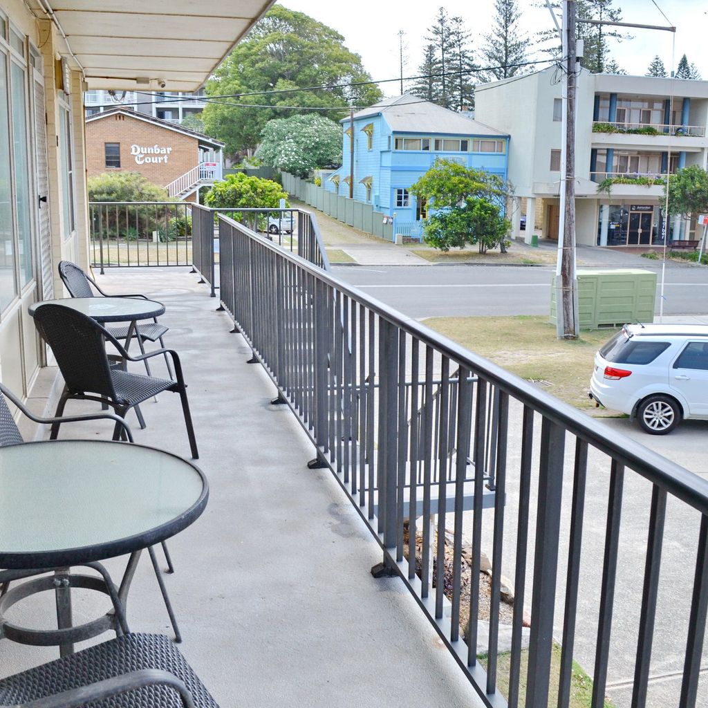 Chair and table outside unit 7.