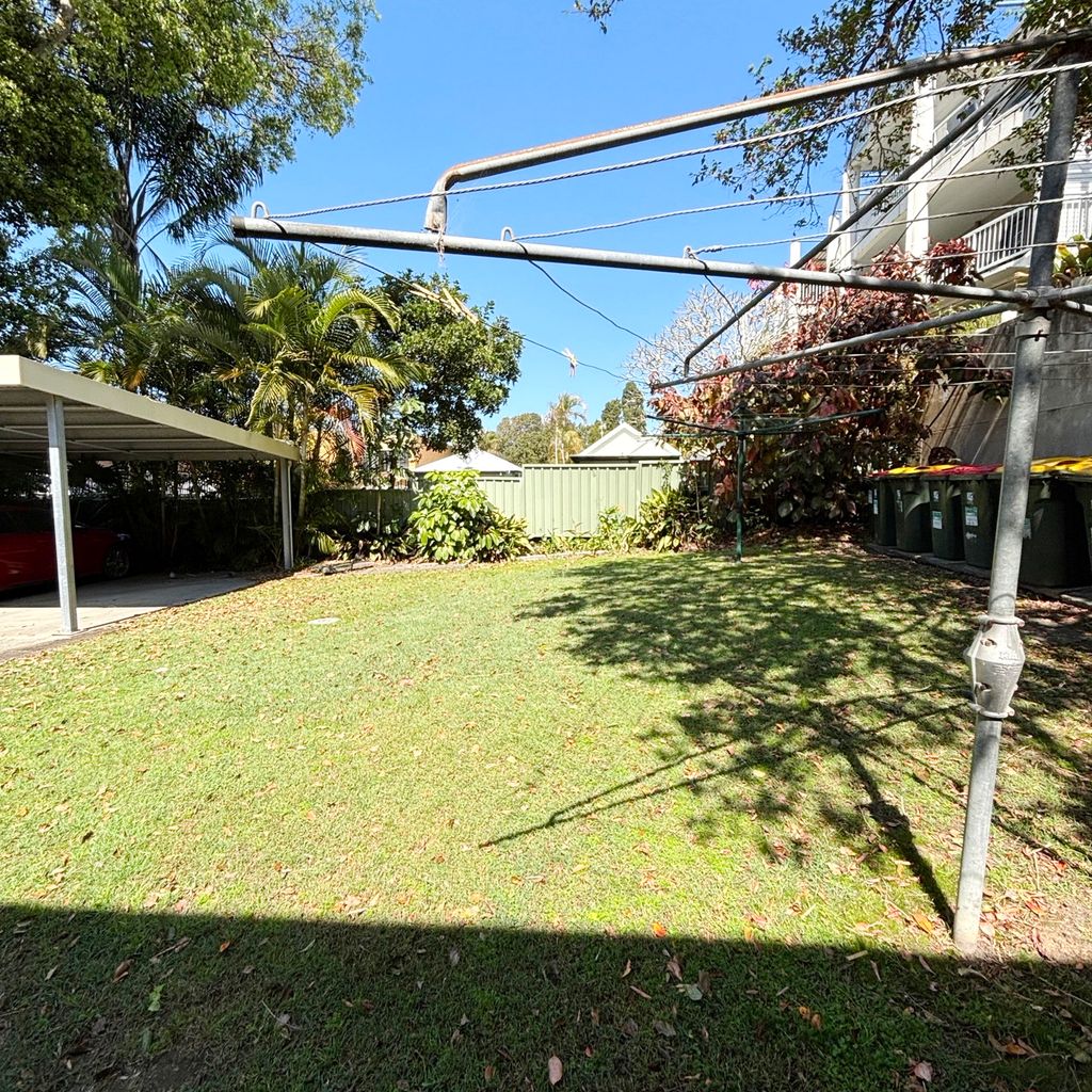 Backyard and carport. 