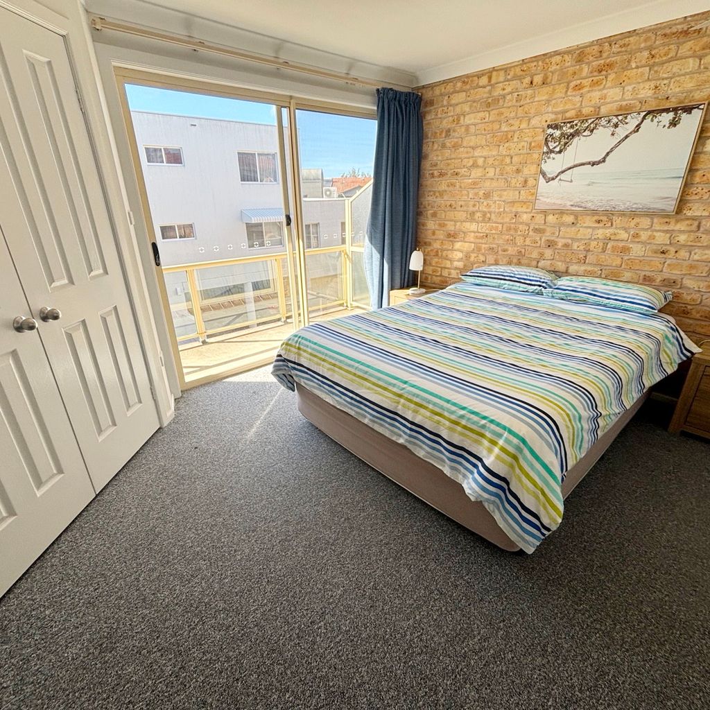 Main bedroom and private balcony. 