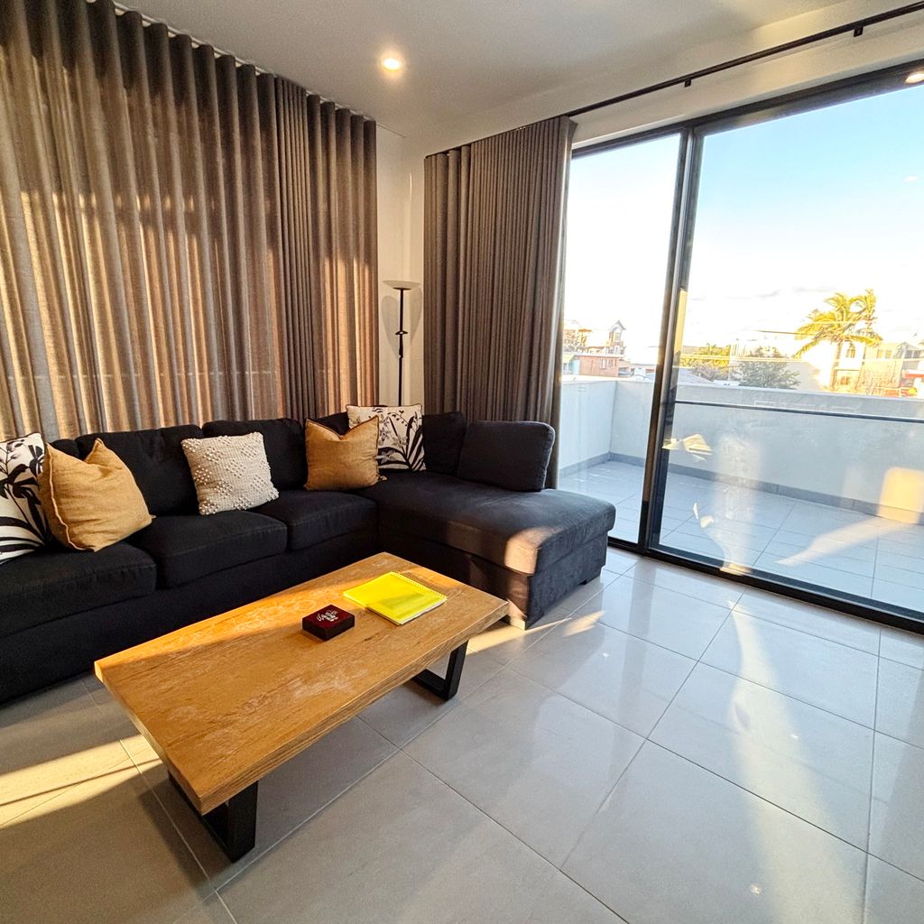 Living area and balcony access.