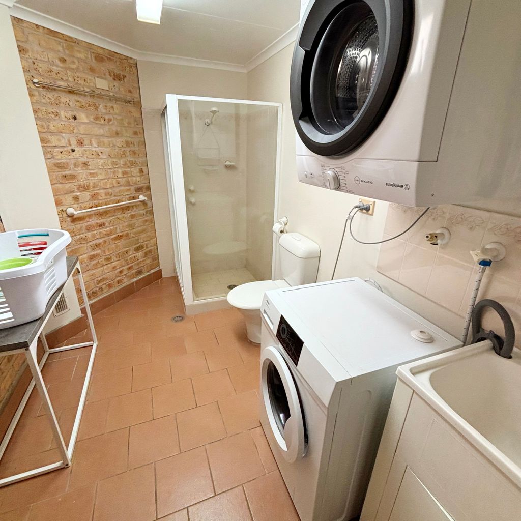 Combined laundry and bathroom. 