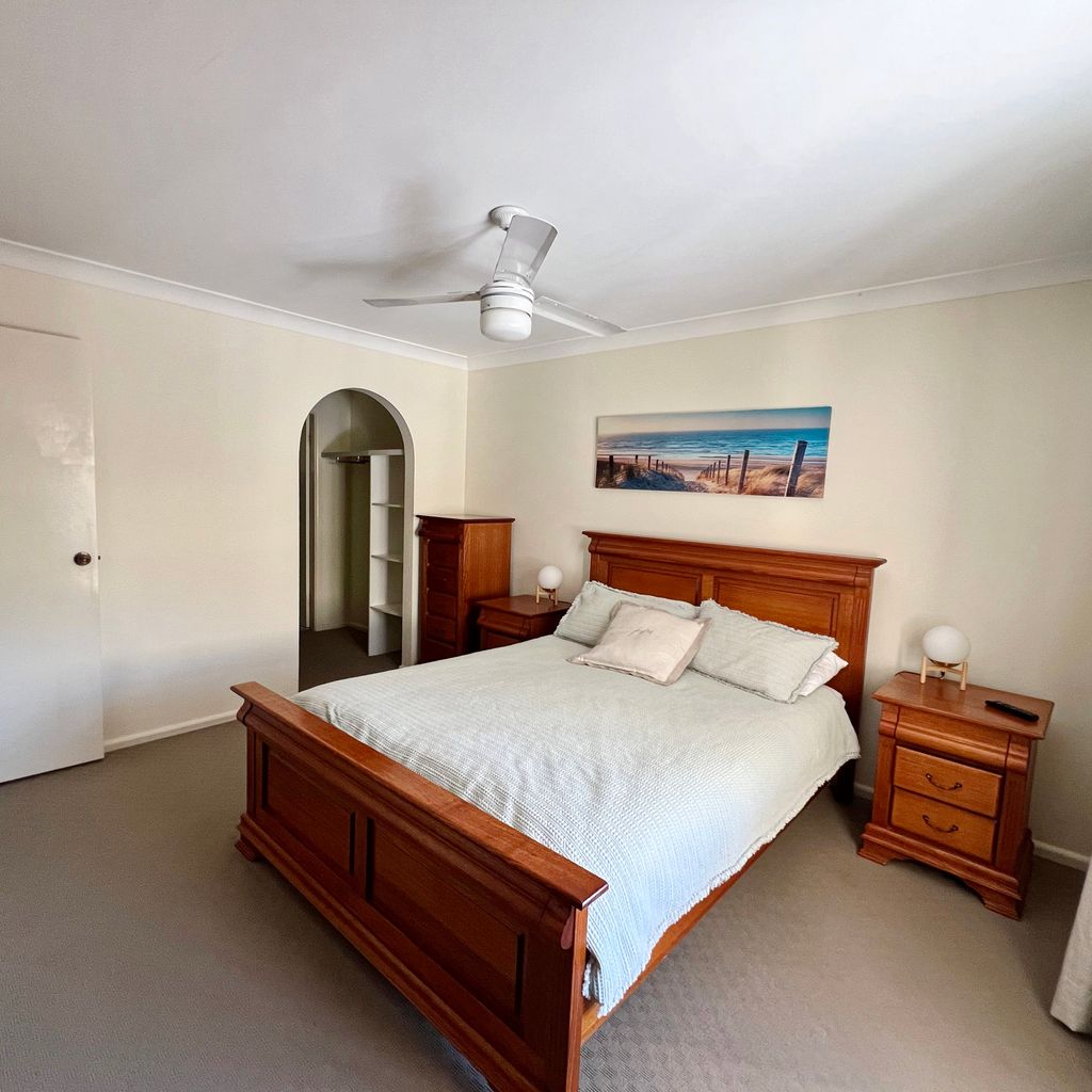 Master bedroom with walk in robe and ensuite beyond.
