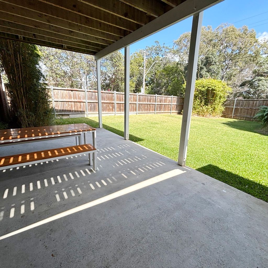 Downstairs outdoor dining and yard view. 
