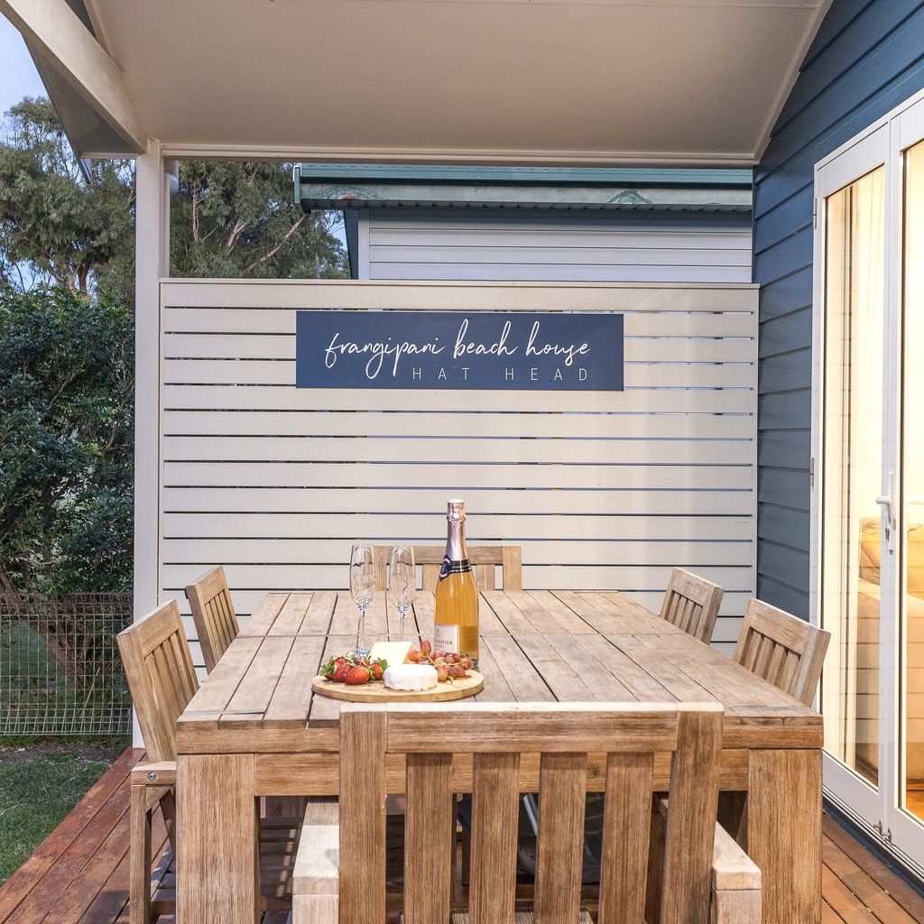 Outdoor dining area on front porch.