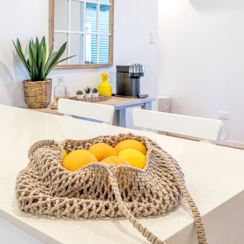 Bag of citrus on the dining set.