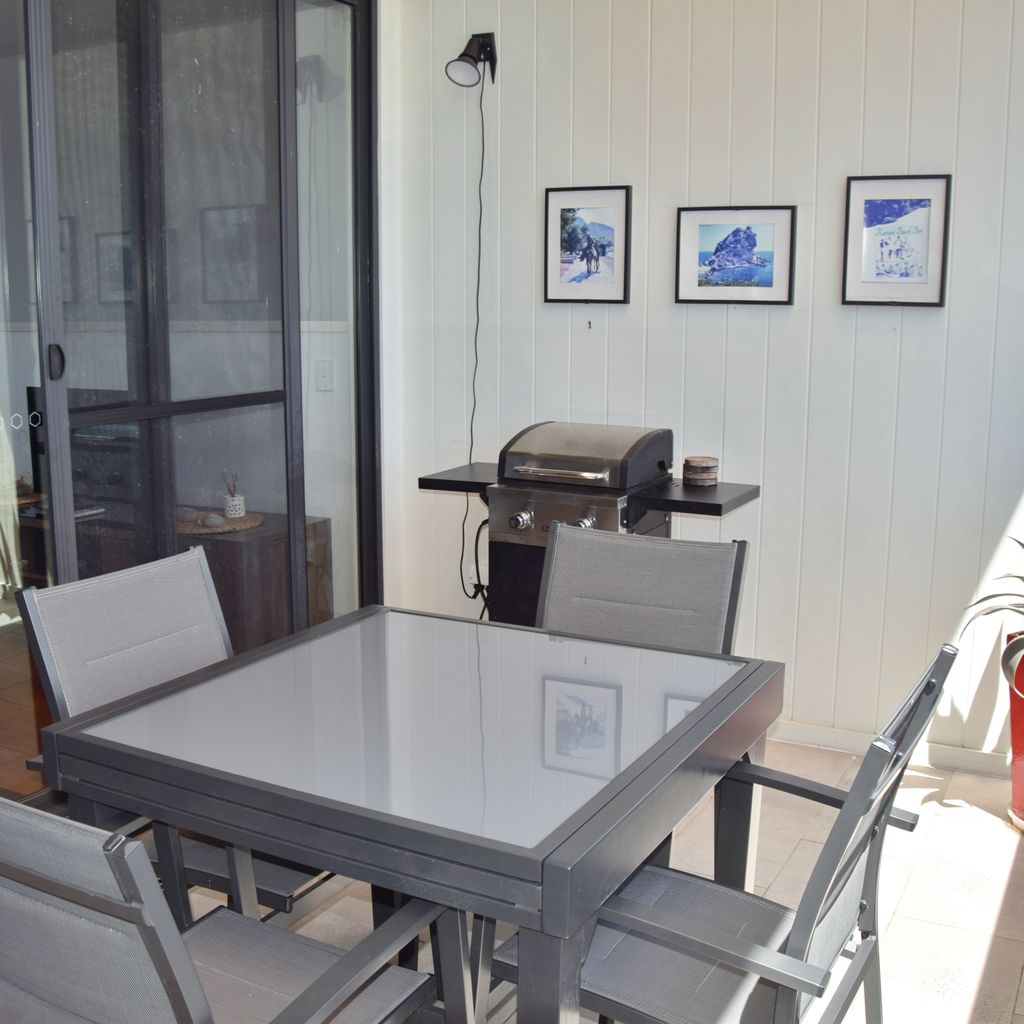 Front balcony with BBQ.