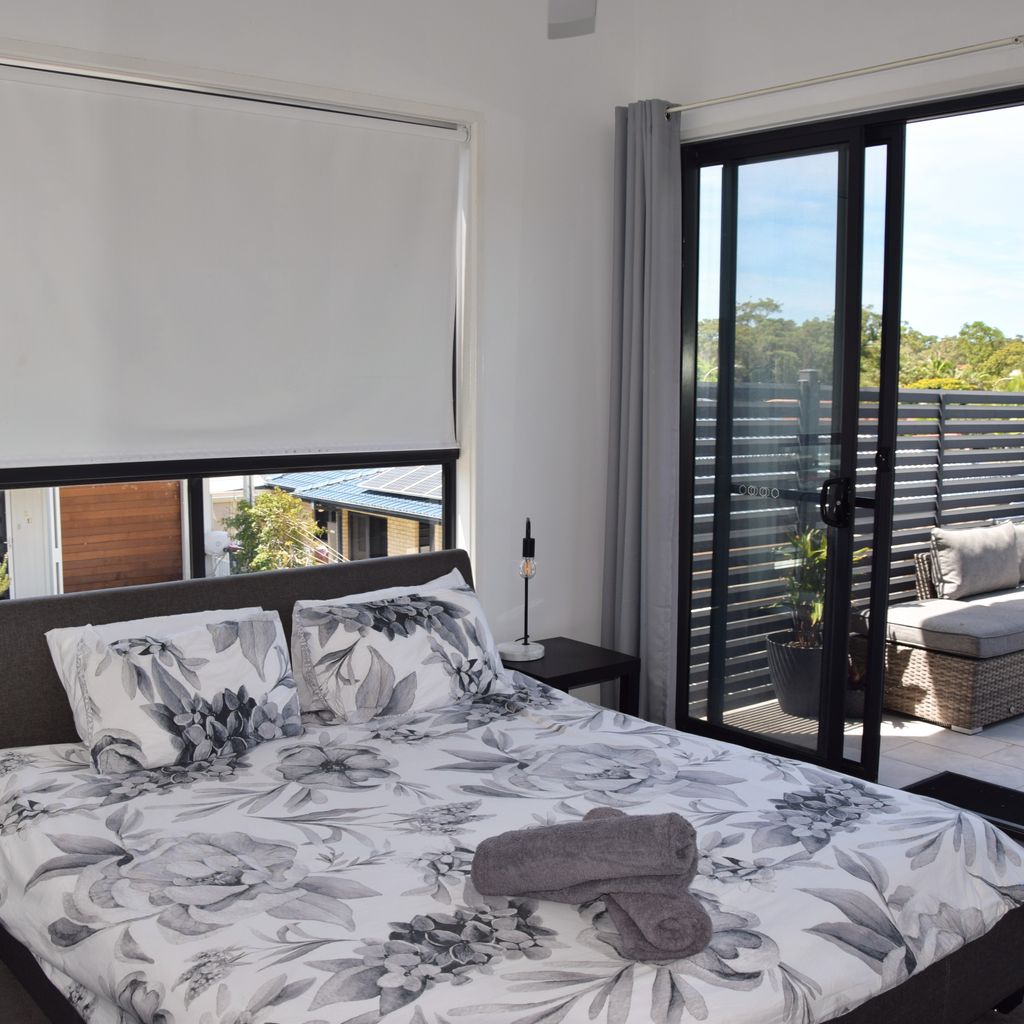 Master bedroom and back balcony.