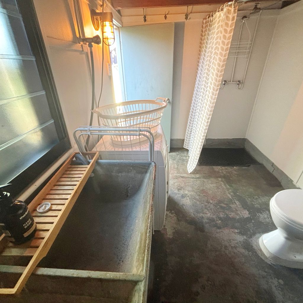Combined laundry and bathroom. 
