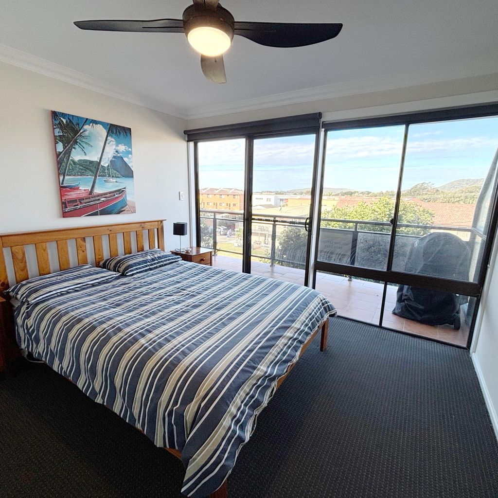 Master bedroom connected to balcony. 