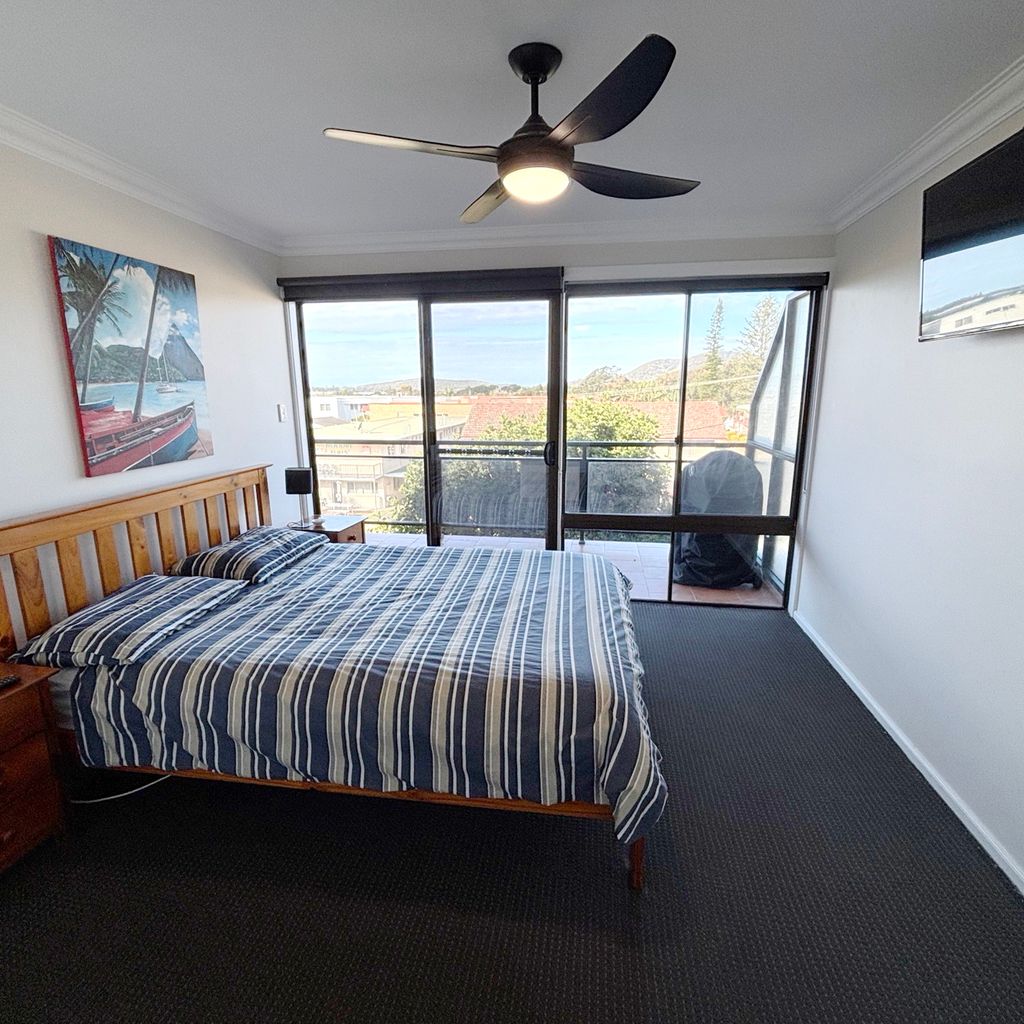 Master bedroom connected to balcony. 