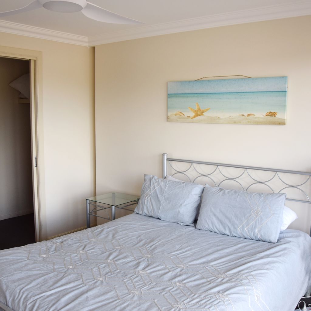 Master bedroom, walk-in robe and ensuite in background.