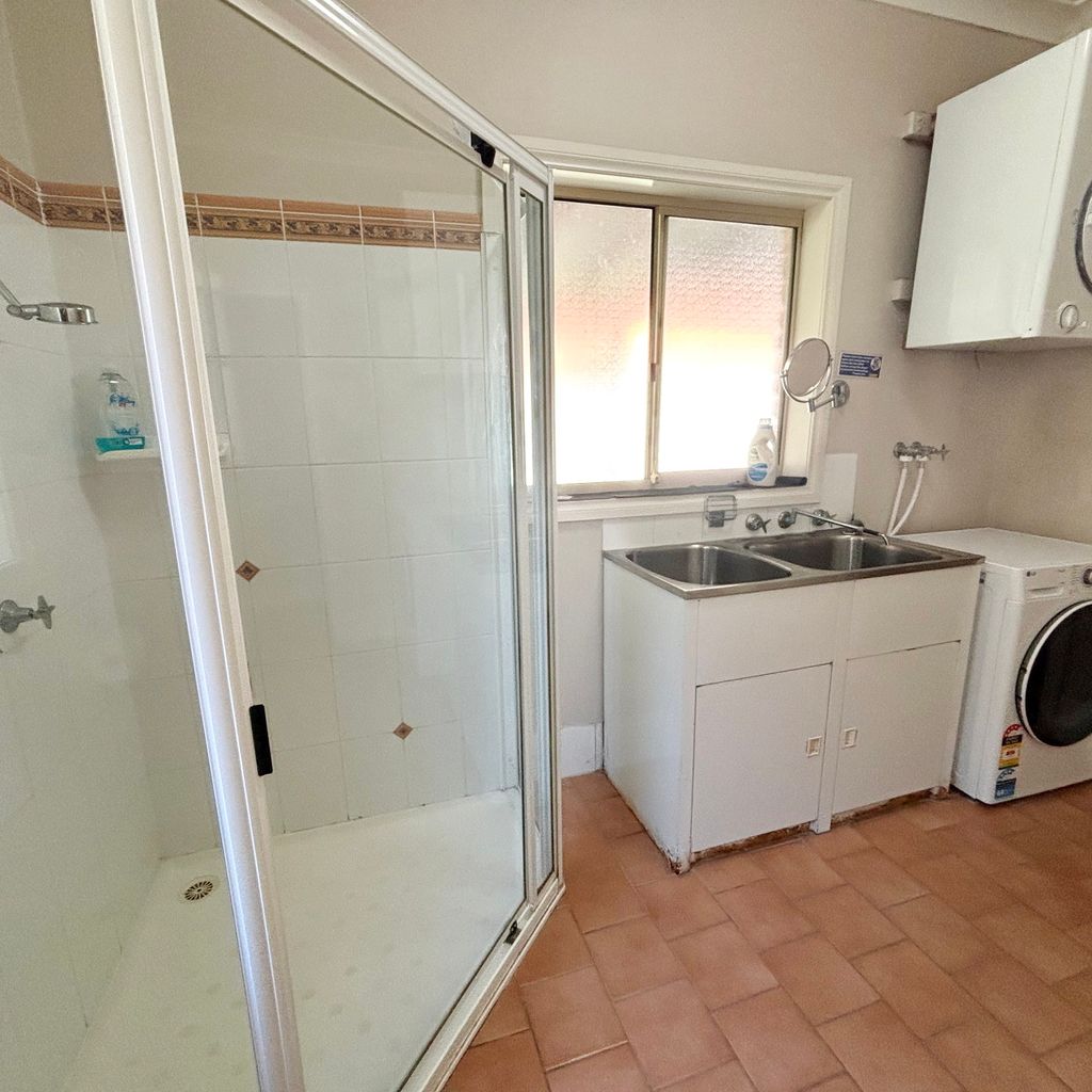 Downstairs laundry and bathroom.  