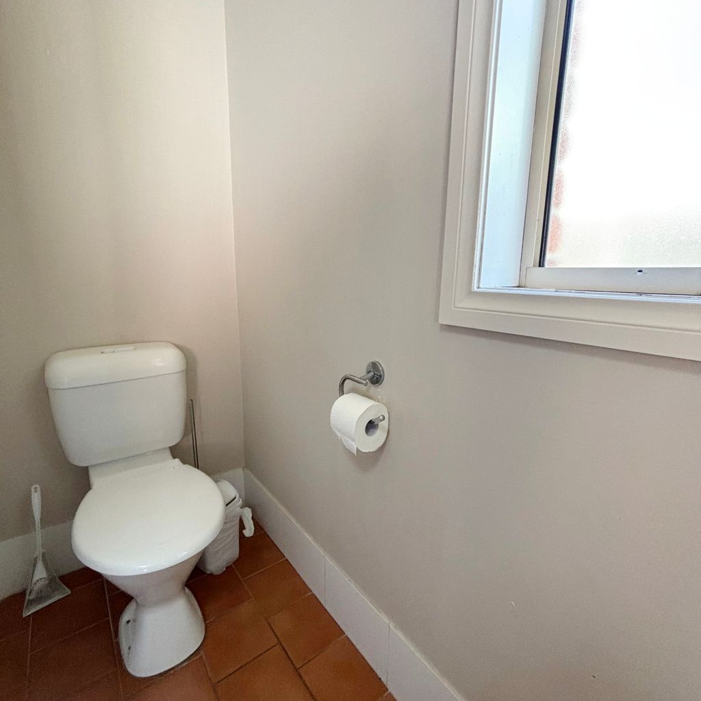 Downstairs toilet in bathroom.