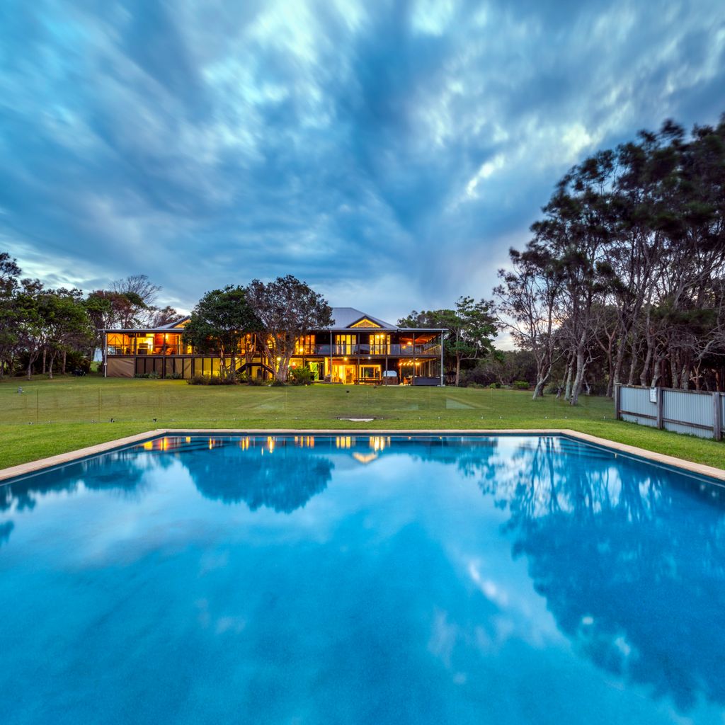 View from the large pool to the back of Tranquilo Beach House The pool at our holiday home in Woolgoolga is 10 metres x 10 metres, enough space for the whole family. 