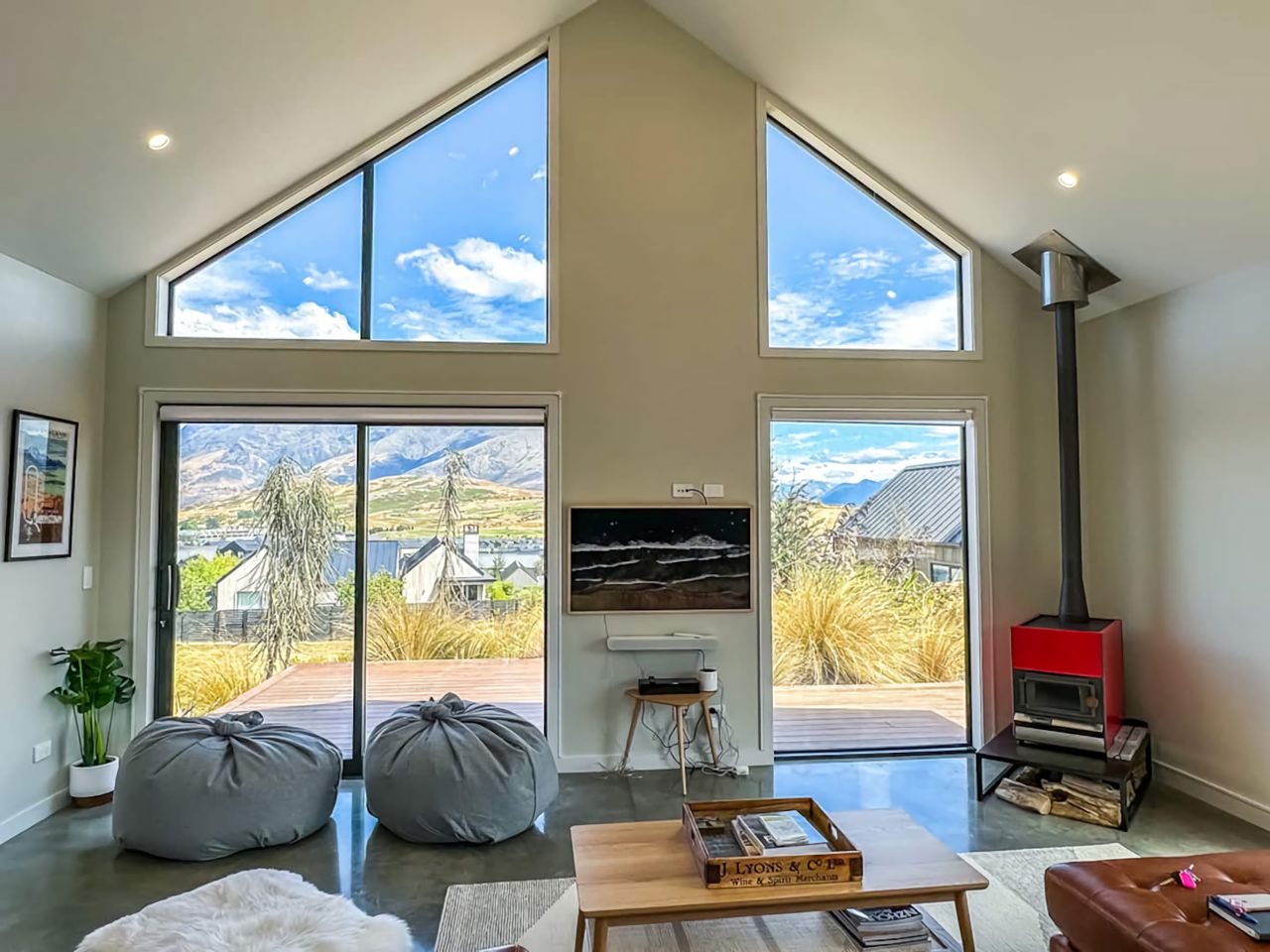 Lounge with feature window and wood fire