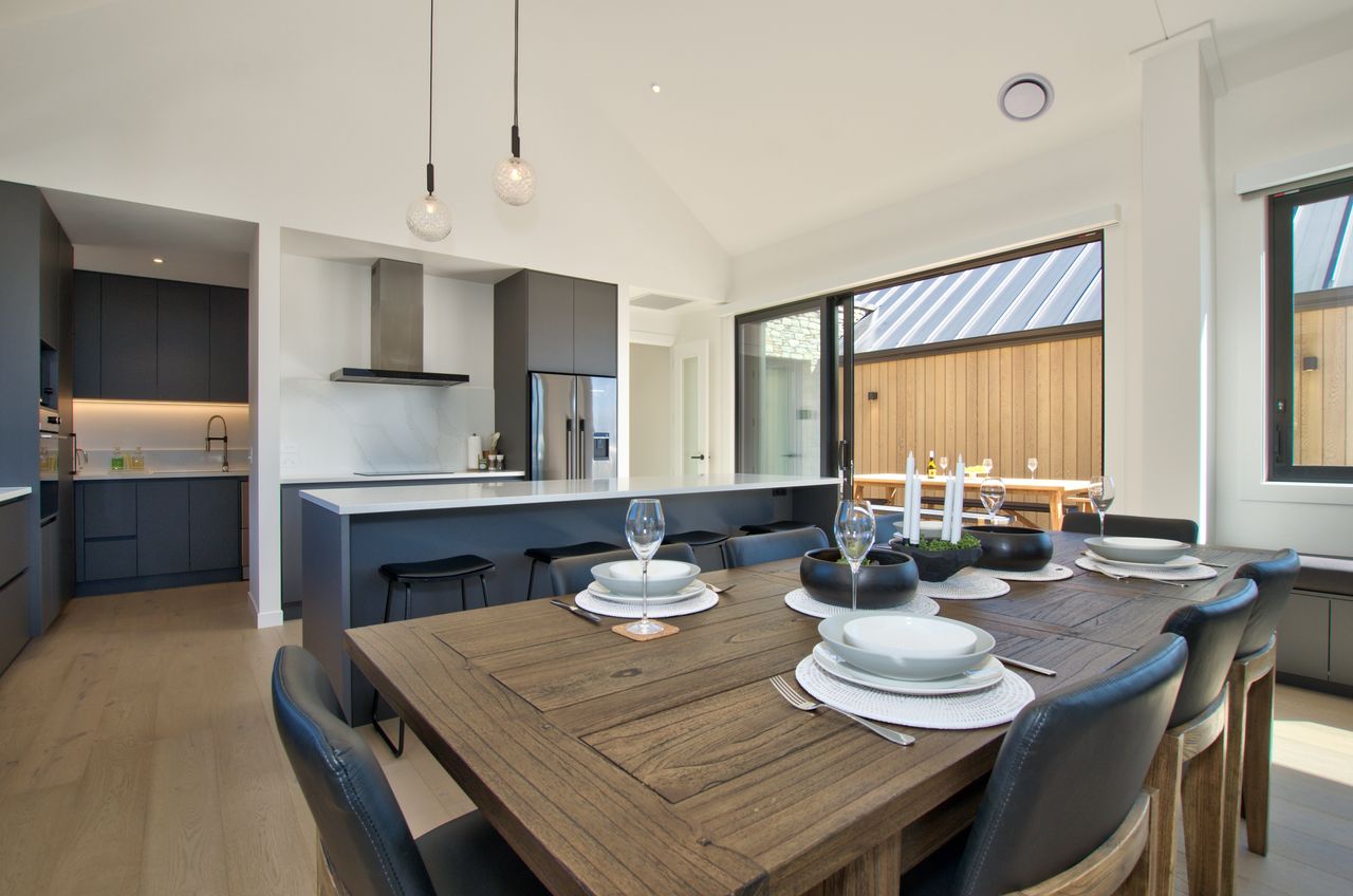 Kitchen dining area with easy access to outdoor dining table and BBQ