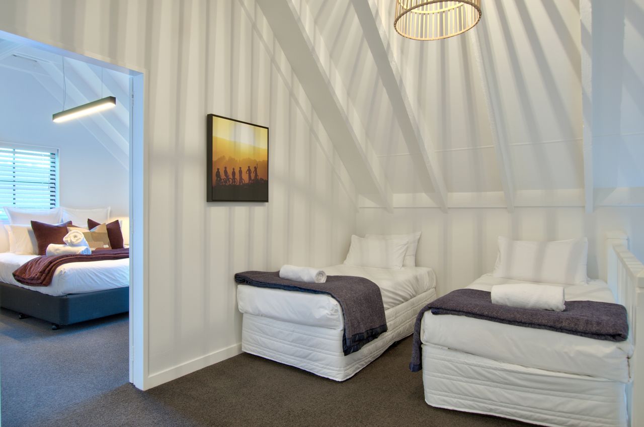 The common area at the top of the stairs can be setup with 2 single beds - on request.