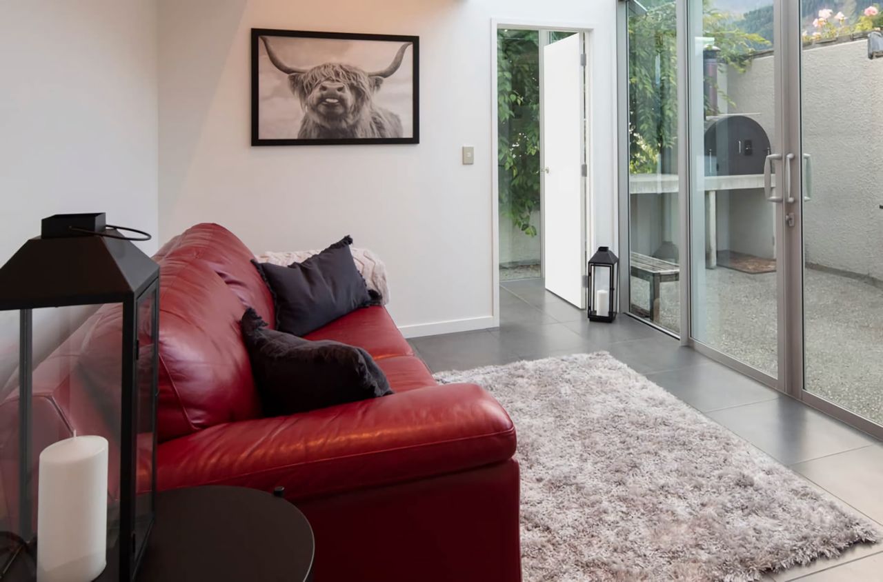 Casual sitting area leading out to BBQ & pizza oven