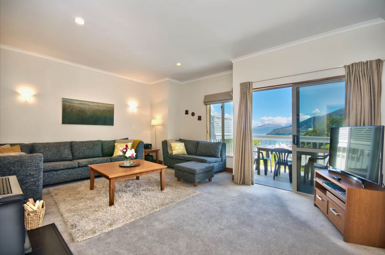 Large lounge which opens up onto balcony