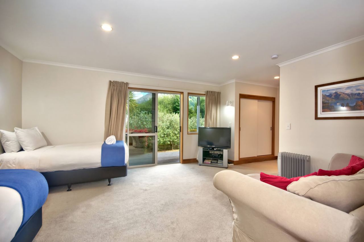 Bedroom 3 - downstairs has TV, Couch & Ensuite