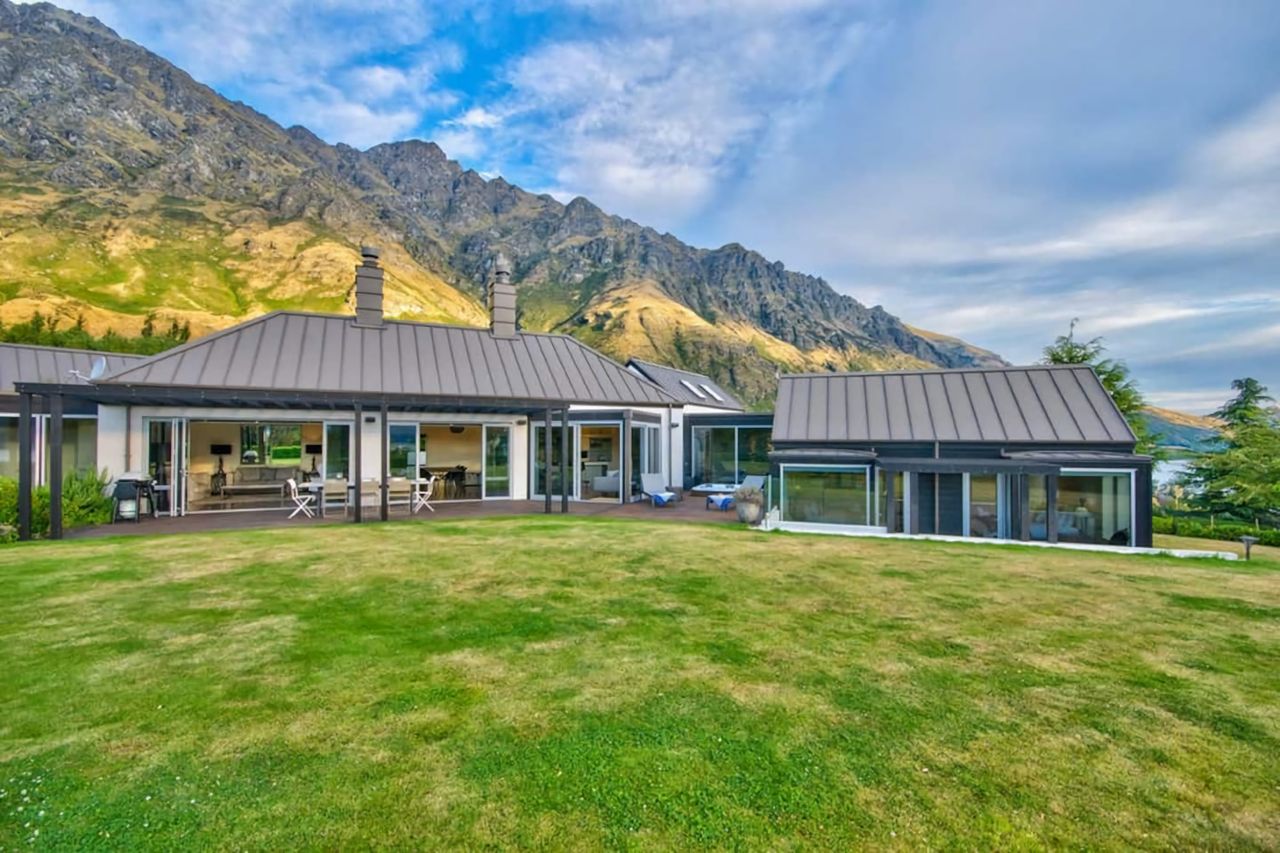 Part view of house - Lounge/dining area on left, outdoor spa in middle & Beds 2 &3 on right