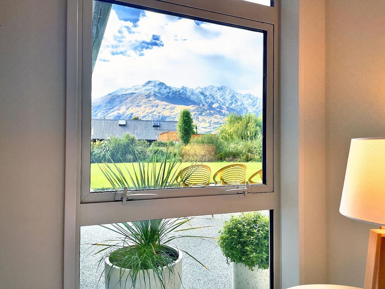 View from Bedroom 4 looking out towards the garden with The Remarkable Mountains in the distance