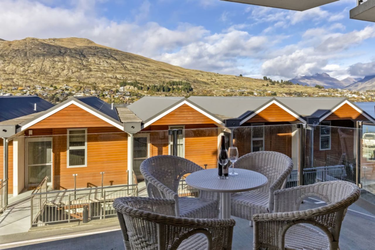 Patio with mountain and partial lake view