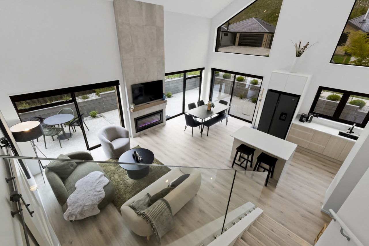 Open plan living with gas fireplace and aircon/heatpump