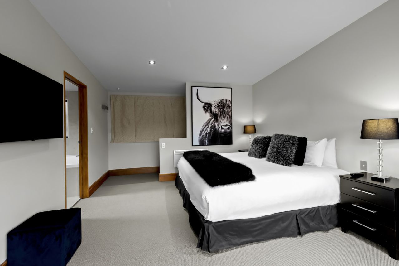 Master ensuite bedroom with king bed