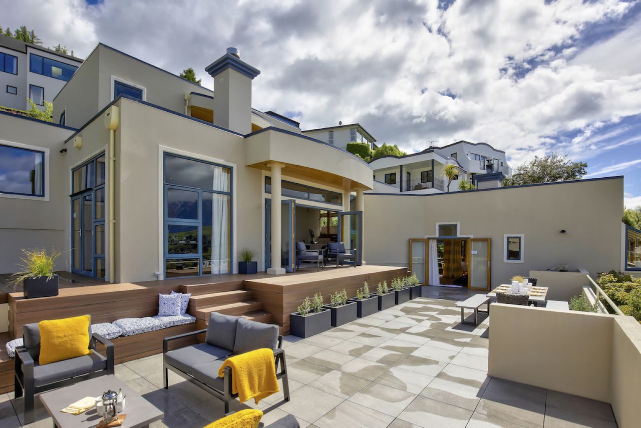 Huge patio with outdoor fireplace, BBQ and dining area