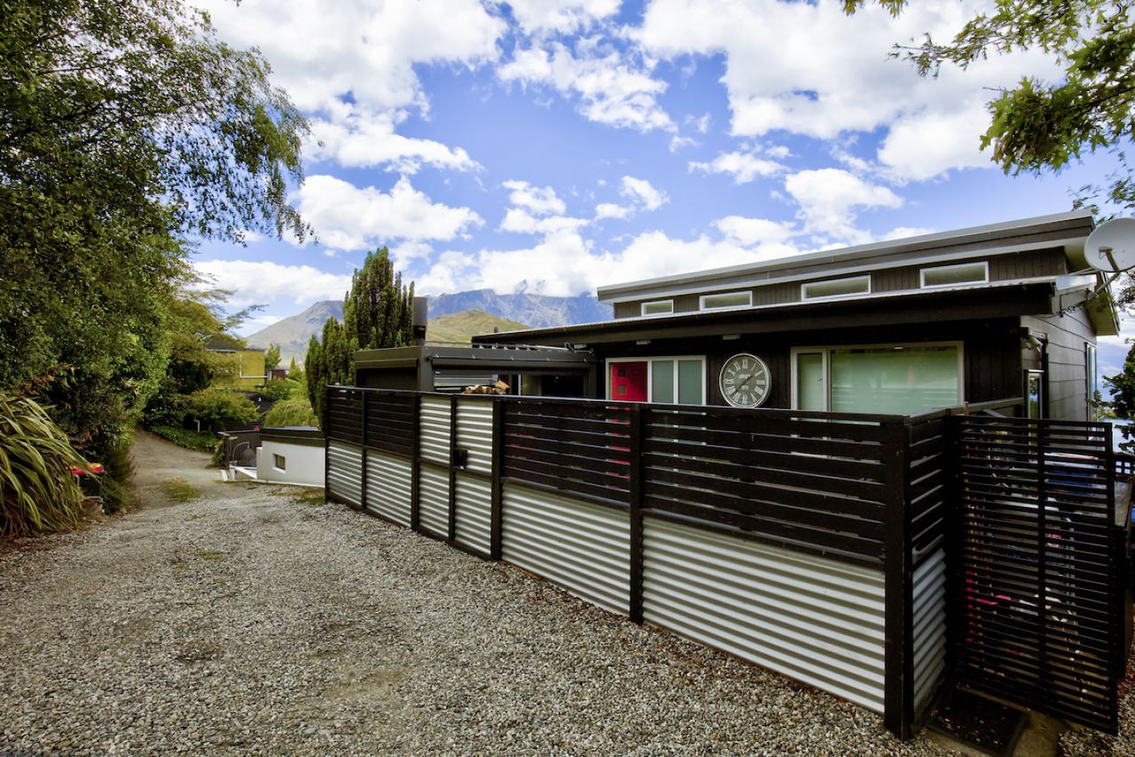Exterior of the property - access front and side with carpark to the right of this photo