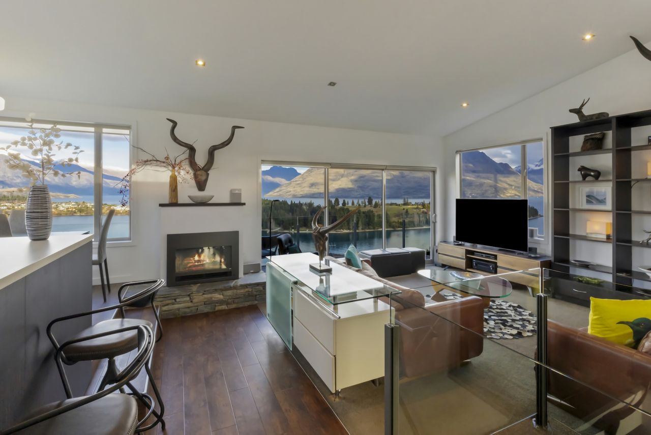 Open plan living with heatpump and gas fireplace