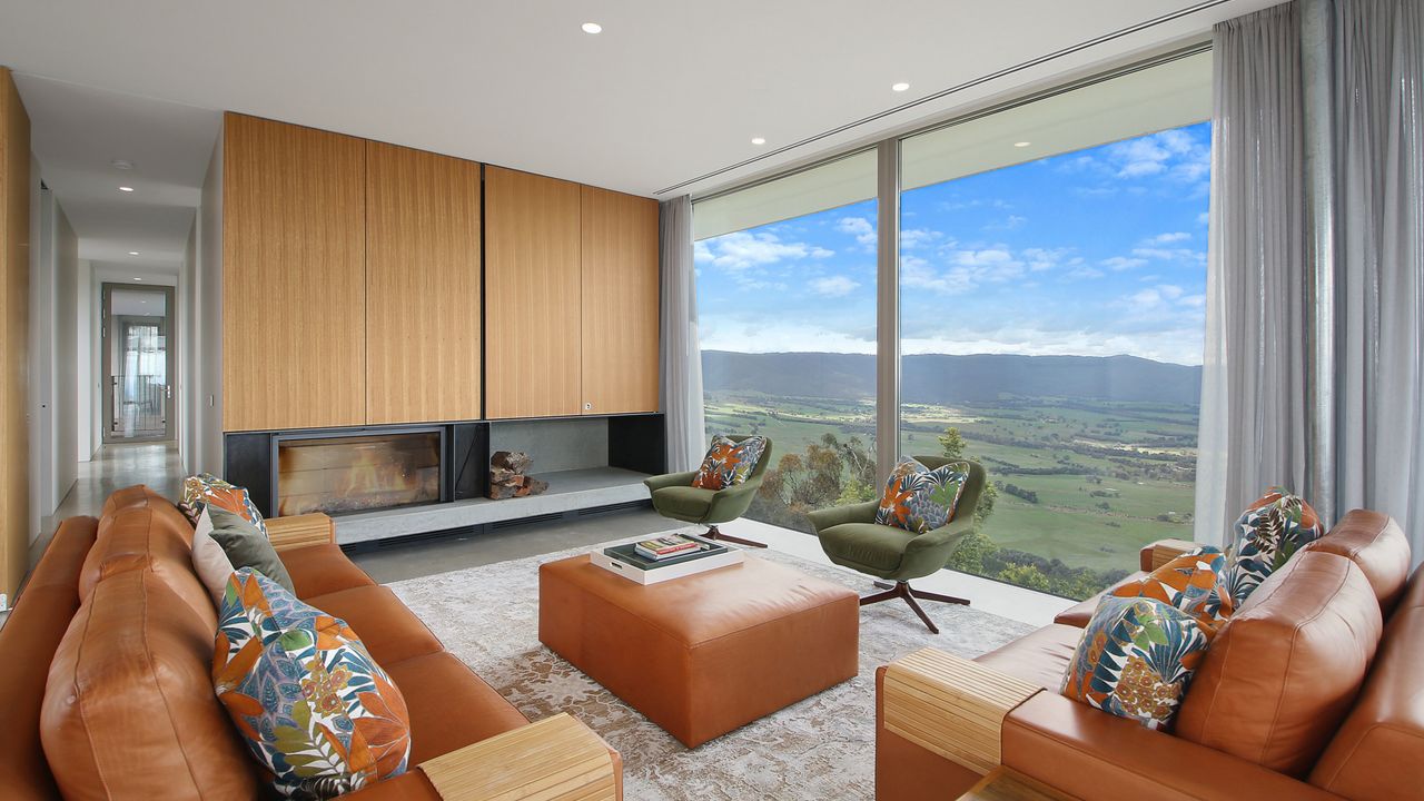 Main living area w/ wood fire & a view