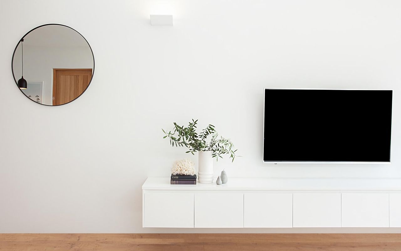 Relax and unwind with entertainment on the large wall-mounted flat-screen TV, perfect for movie nights and catching up on your favorite shows
