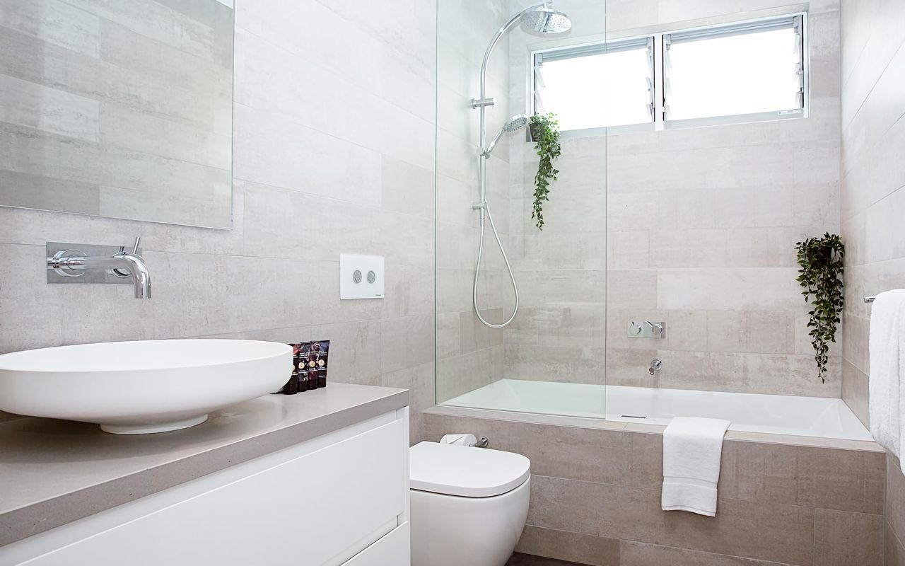 Luxurious bathtub and double shower in one of the modern bathrooms