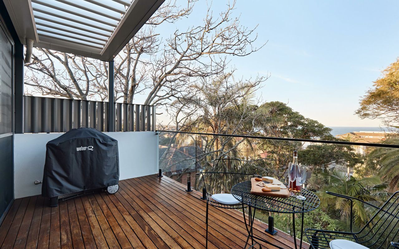 Relax and unwind outdoors with views of Coogee, complemented by stylish, comfortable seating.