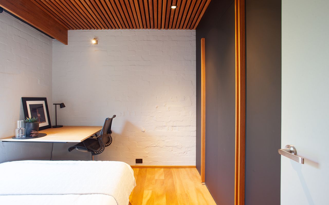 Bedroom with dedicated workplace