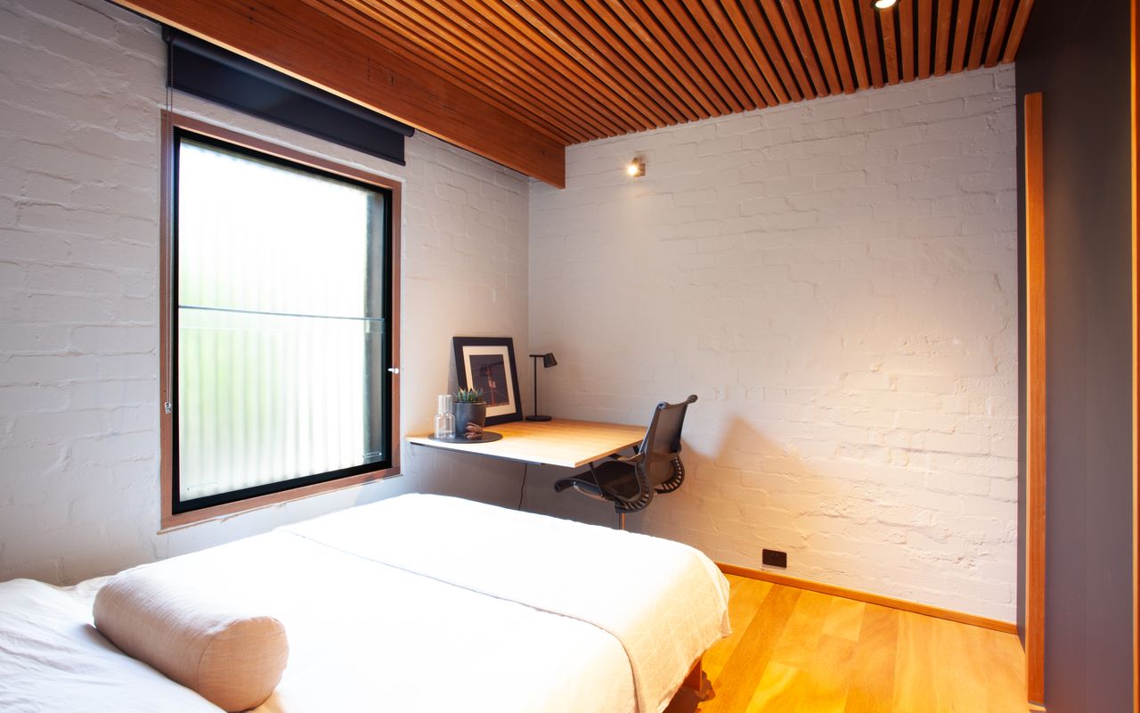 Bedroom with dedicated workplace