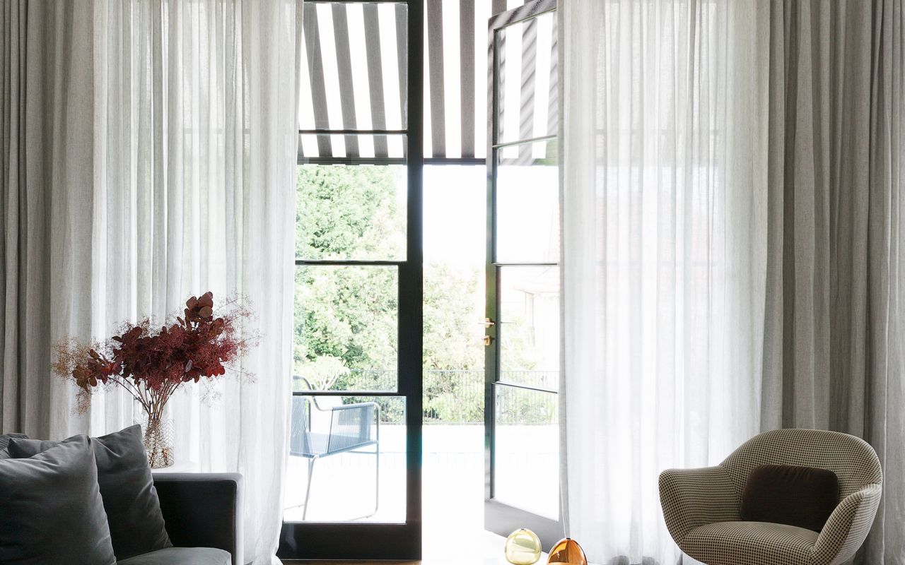 Lavish living room with a dramatic chandelier for grand conversations.