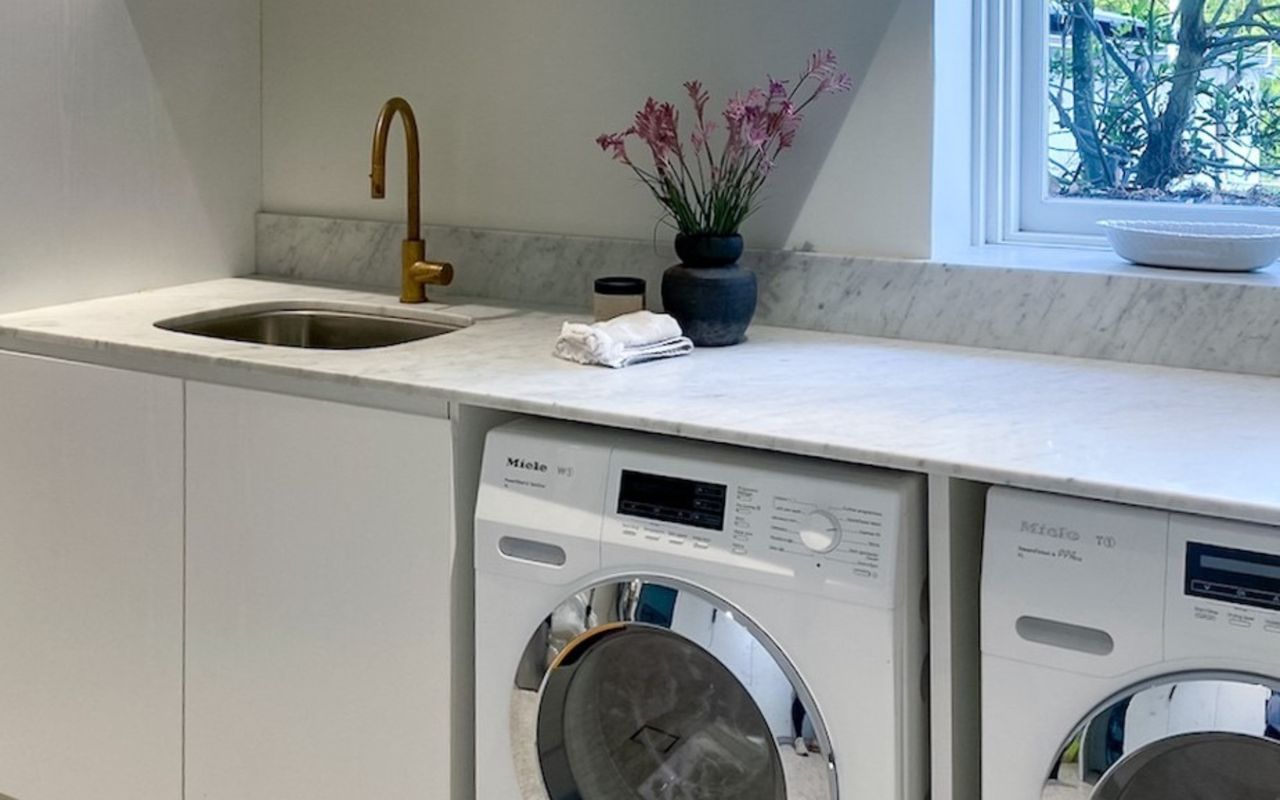 Efficient and stylish: our modern laundry space.