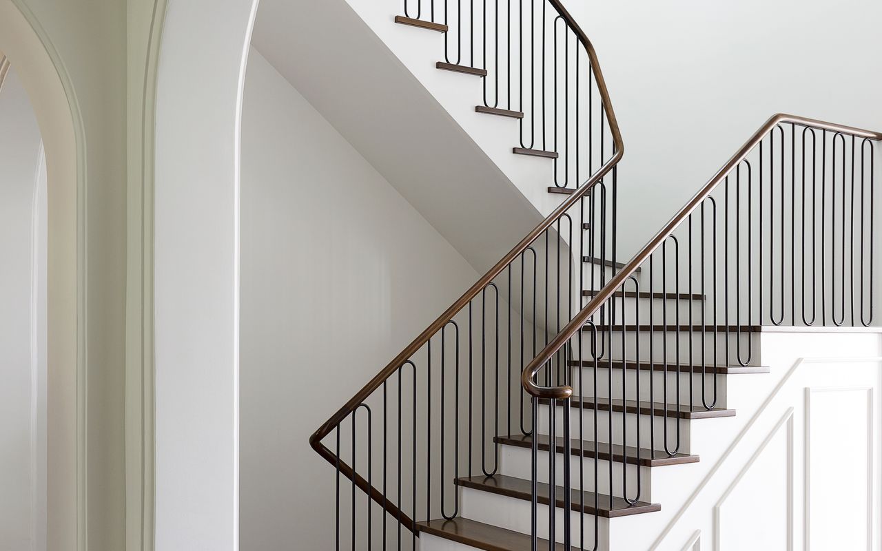 Grand staircase with elegant railings and historic charm.