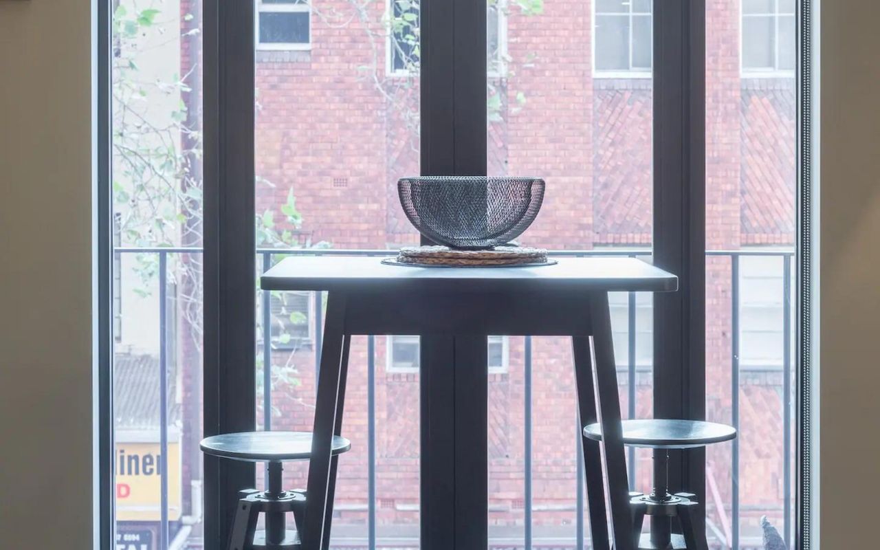 Step into elegance with French doors opening to city views.