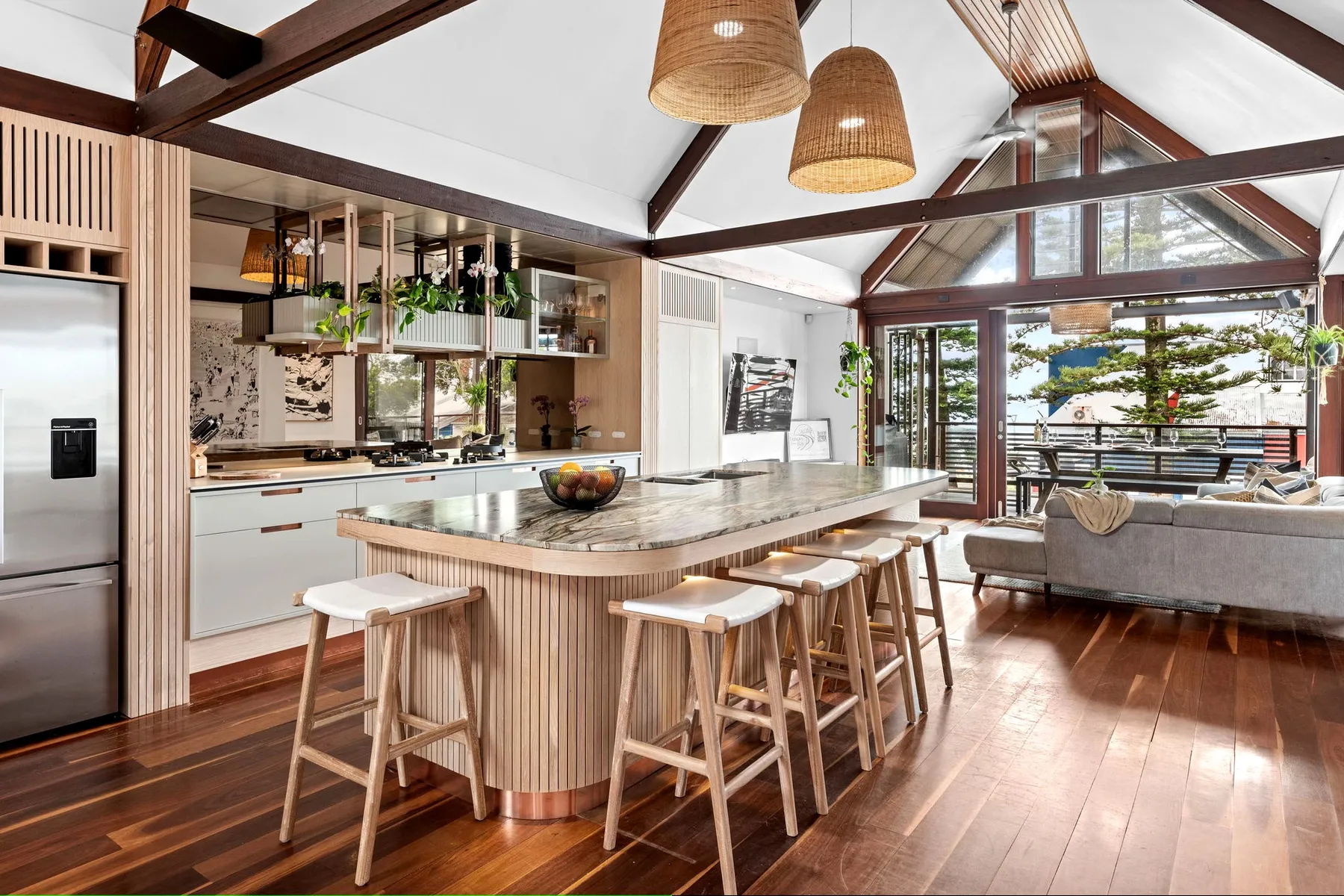 Kitchen island beneath exposed timber beams