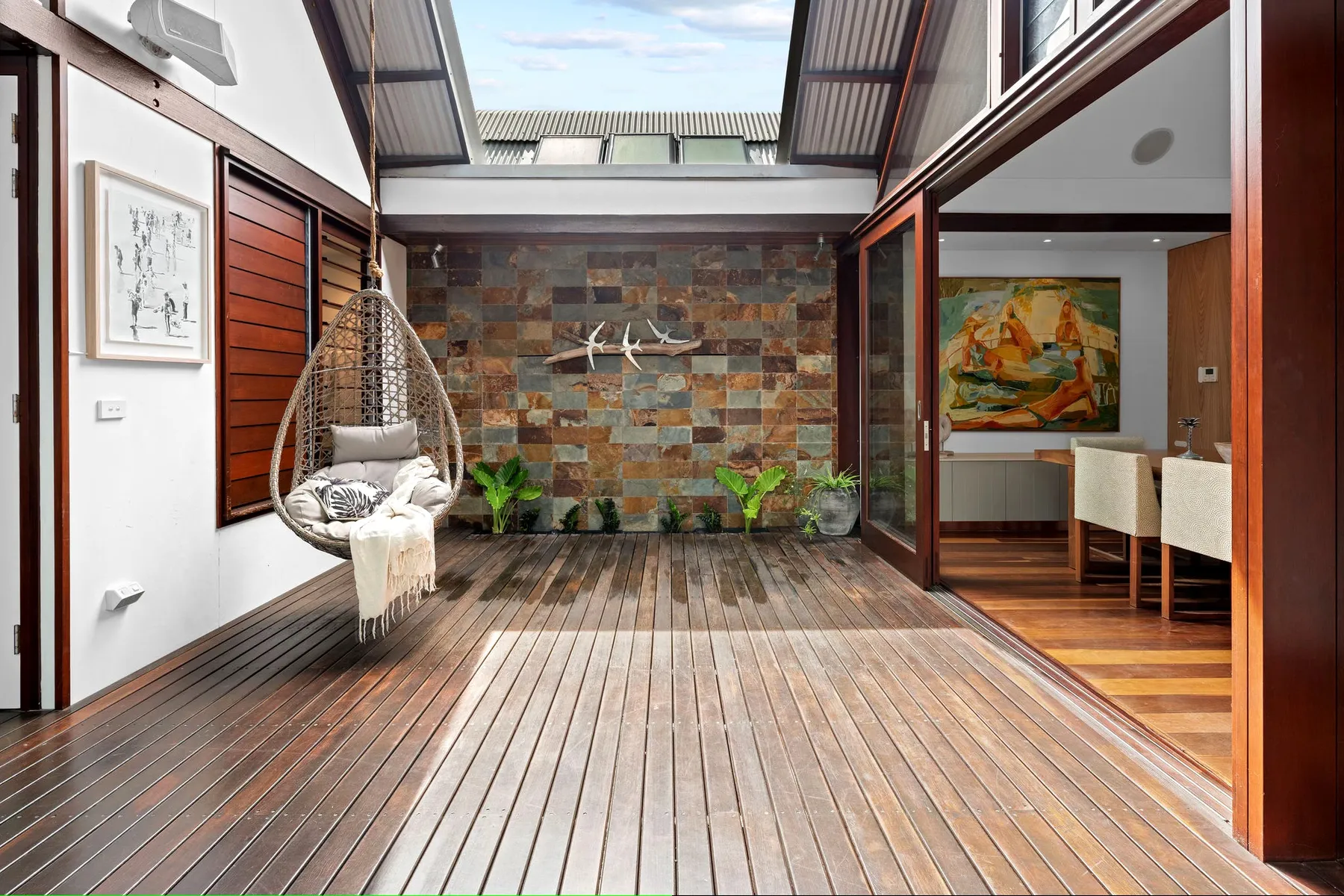 Timber entry deck lined with planting