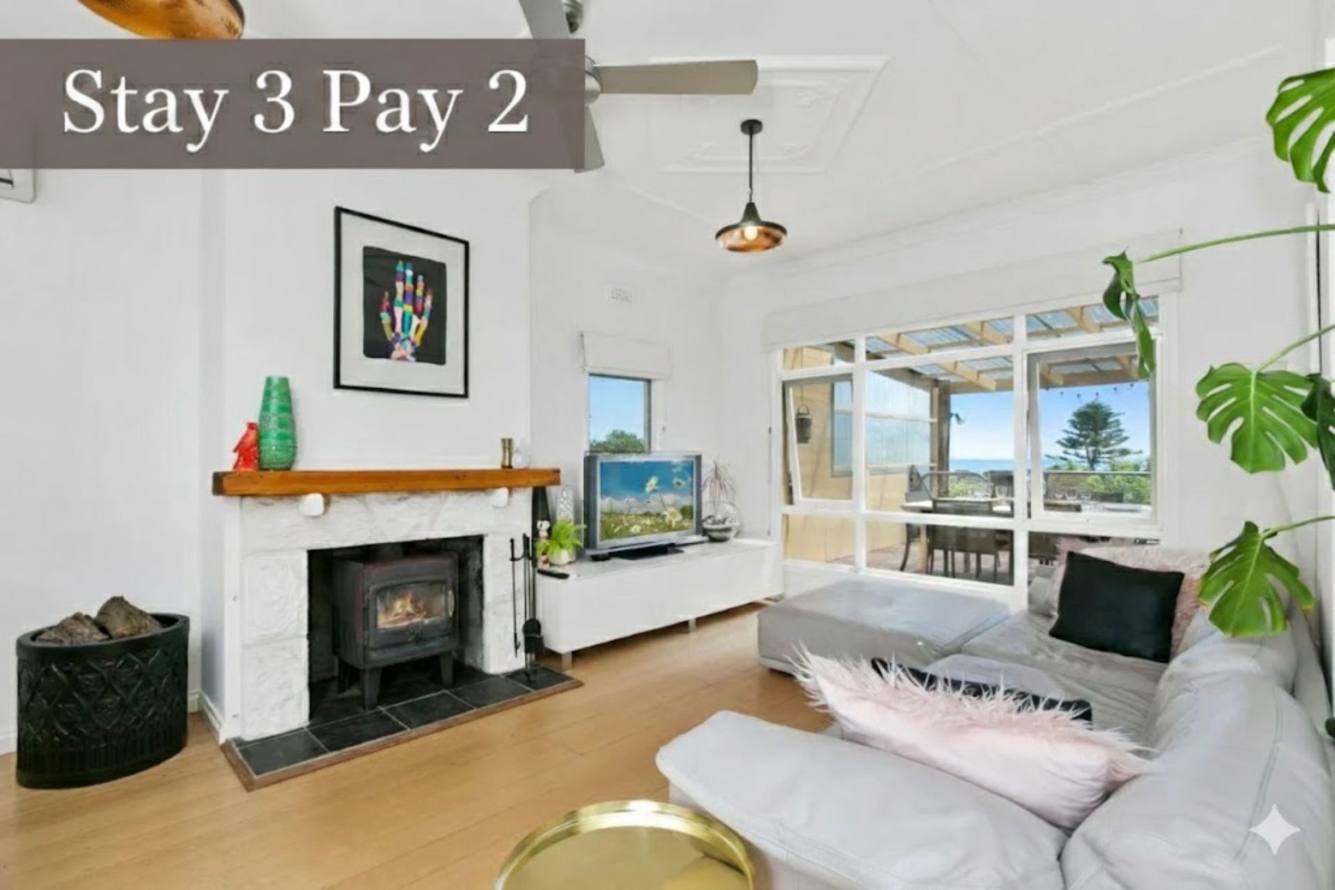 Living area with open fireplace and Smart TV