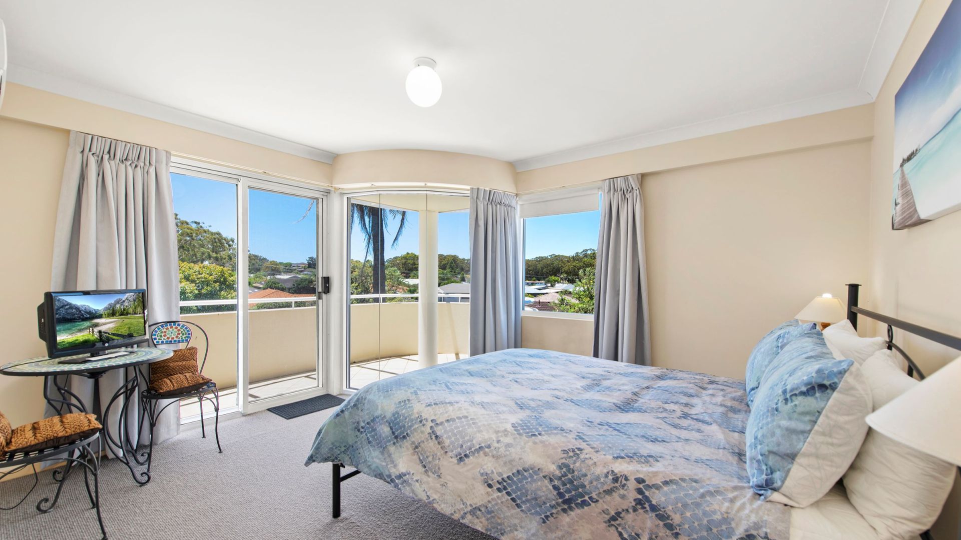 Bedroom 1: Queen bed, a built-in robe, balcony access, and an ensuite with a shower and toilet.