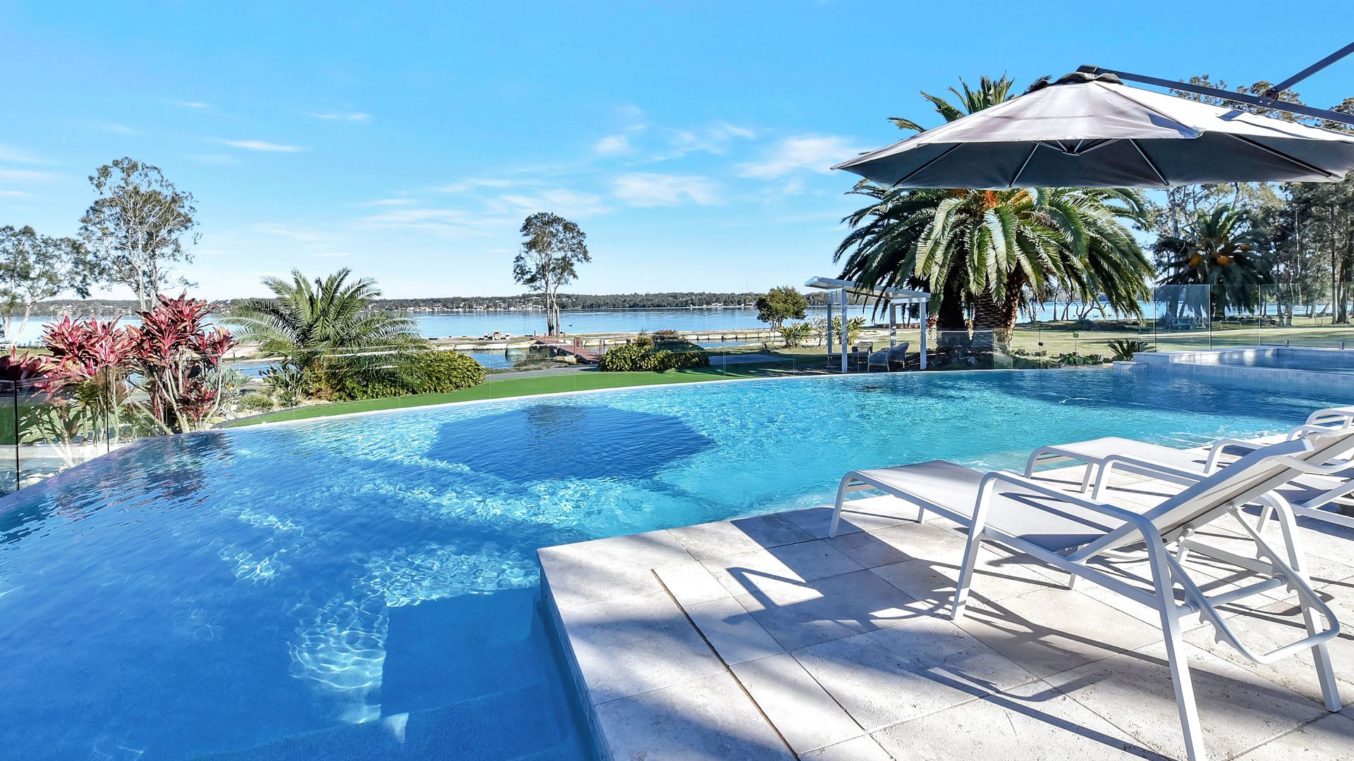 Lake Palm Resort Luxury Retreat absolute Waterfront on 3 acres at Lake Macquarie.